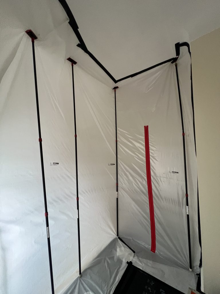 Protective containment sheeting inside a room